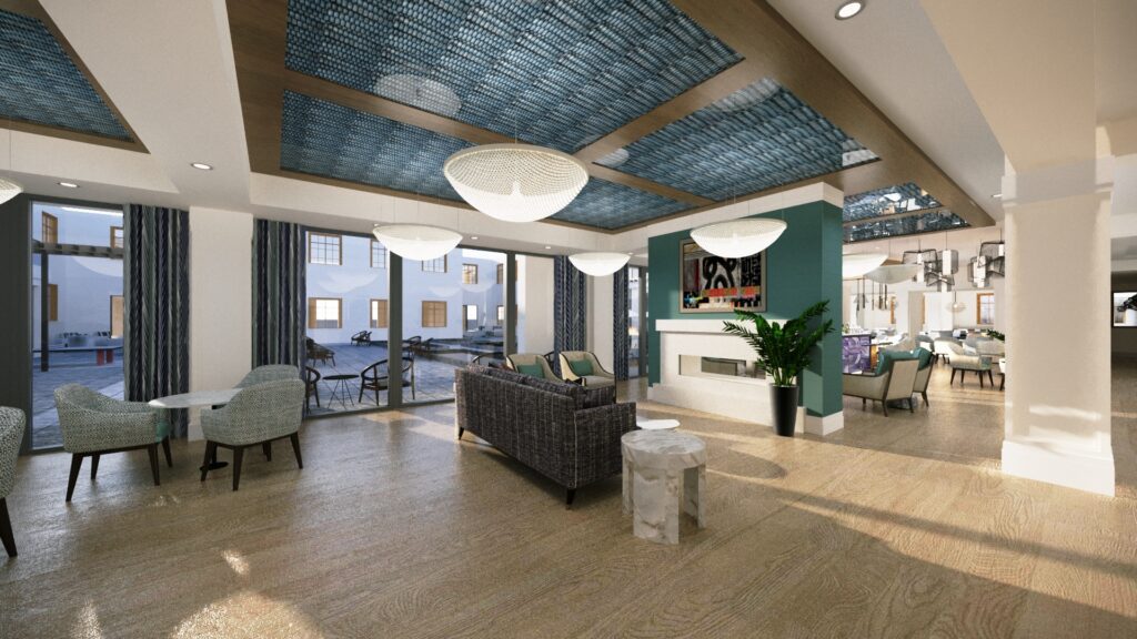 Interior image of the seating area and community space with comfortable furniture and electric fireplace.